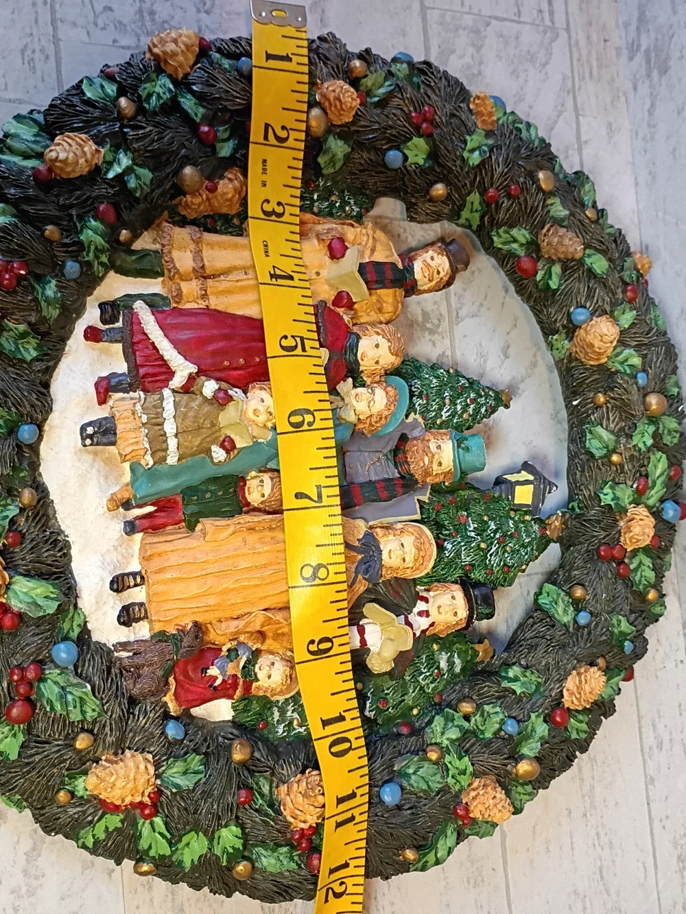 Resin wreath with vintage Christmas carols: traditional Christmas decoration